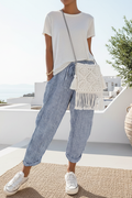 Pantalon large à rayures — Vogue Française