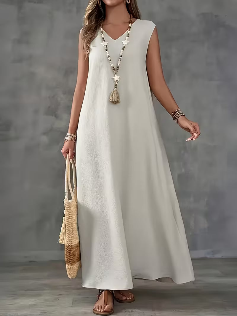 Robe longue blanche subtile — Vogue Française