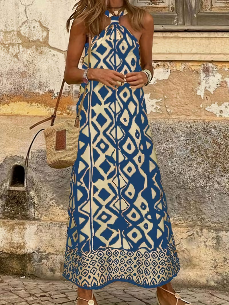 Robe longue raffinée à imprimé géométrique avec col halter — Vogue Française