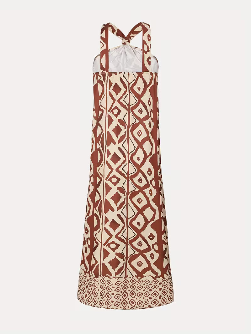 Robe longue raffinée à imprimé géométrique avec col halter — Vogue Française
